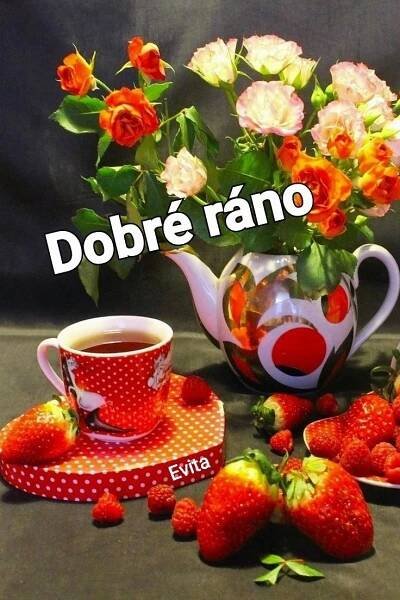 there is a tea pot with strawberries and roses in it next to a cup