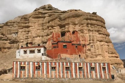 Bright red Nyphu Gompa, built into the cliffside