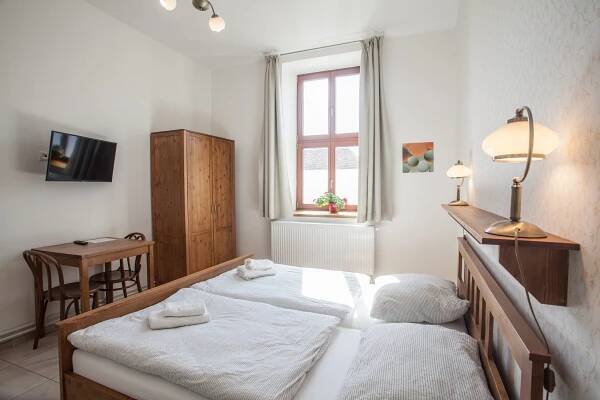 Postel nebo postele na pokoji v ubytování Penzion a restaurace U Hájků