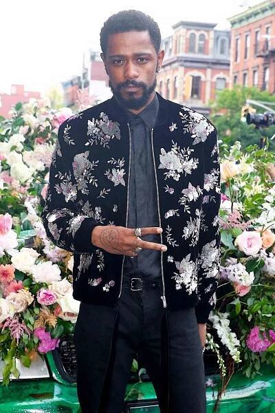 Lakeith Stanfield blends into the floral atmosphere