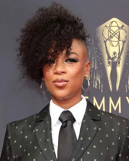 Samira Wiley wears curly pixie cut with the side of her hair shaved