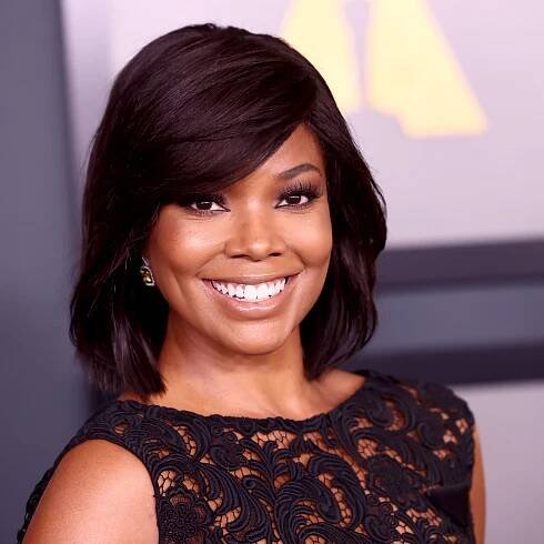 Gabrielle Union's Gravity-Defying Afro Puff Is Literally Wrapped in Gold — See Photos