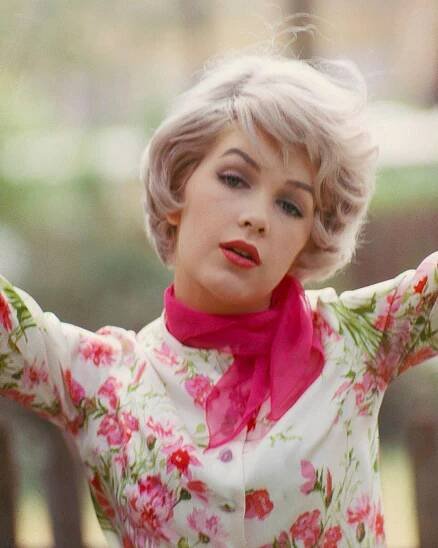 Stella Stevens In A Flower Print Top And Pink Scarf, Late 1960S.