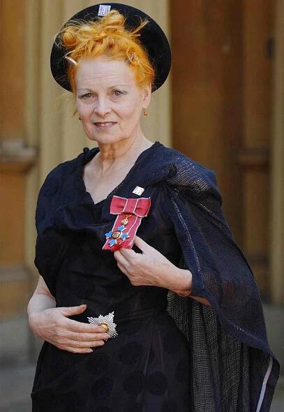 Dame Vivienne Westwood poses for photographers after collecting her ensignia from the Prince of Wales during an Investiture ceremony at Buckingham Palace in London, 09 June 2006