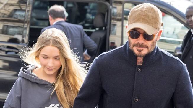 Harper Beckham holds hands with dad David in Paris – and she looks so tall