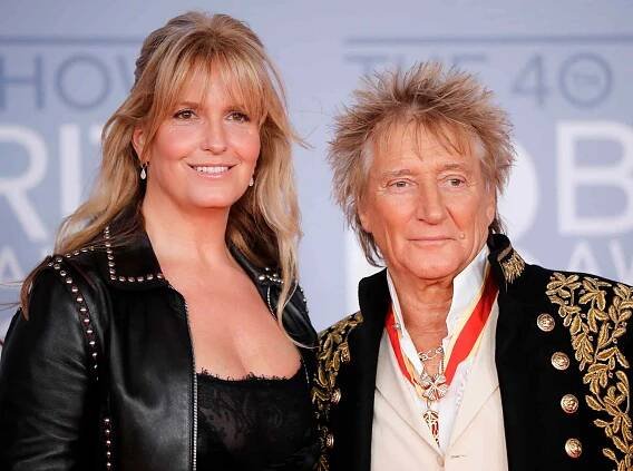 Rod Stewart (R) and his wife Penny Lancaster (L) pose on the red carpet on arrival for the BRIT Awards 2020 in London on February 18, 2020