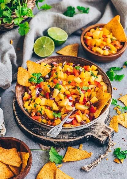 Mexican Salsa with mango, red peppers, onions, jalapeños, cilantro and lime juice