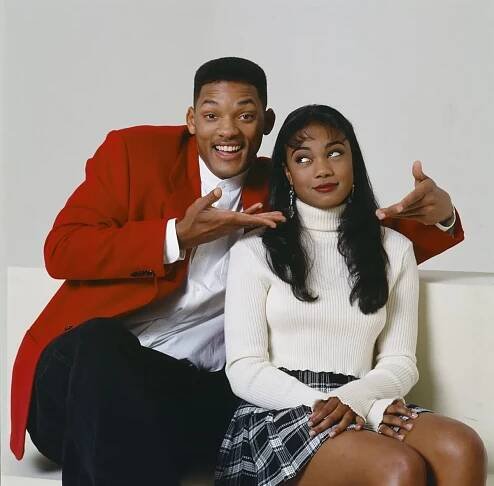 Tatyana Ali posing alongside Will Smith.