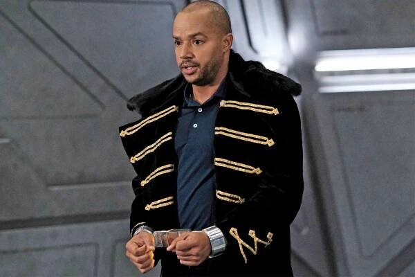 Legends of Tomorrow -- "Knocked Down, Knocked Up" -- Image Number: LGN713a_0077r.jpg -- Pictured: Donald Faison as Mike/Booster Gold -- Photo: Bettina Strauss/The CW -- (C) 2022 The CW Network, LLC. All Rights Reserved.