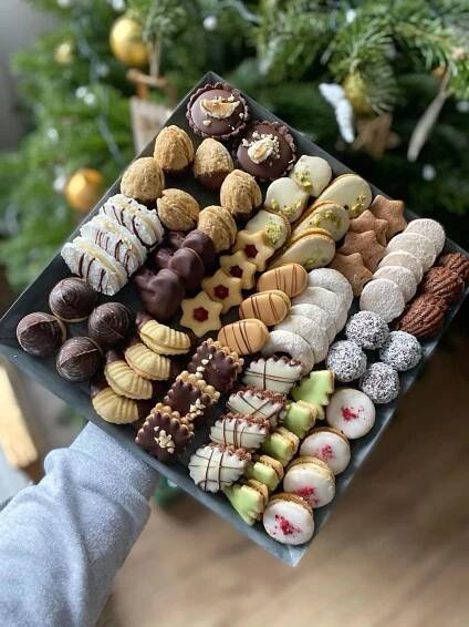 a tray filled with lots of different types of cookies
