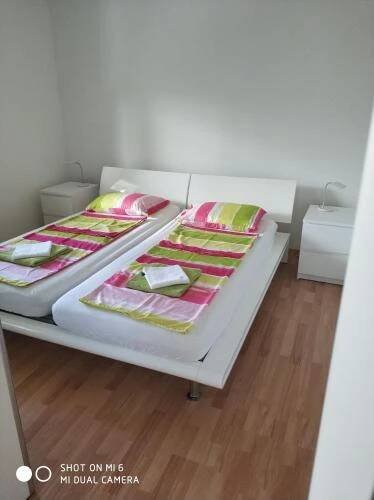Postel nebo postele na pokoji v ubytování Apartments Nogic