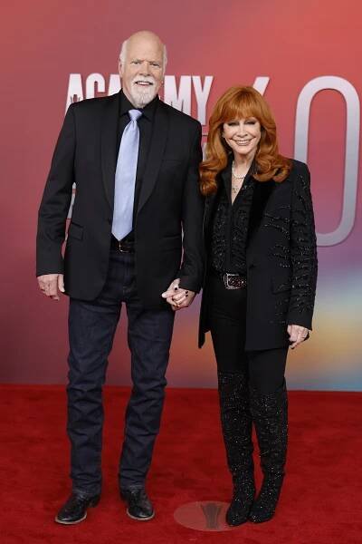 Reba McEntire and Rex Linn Hold Hands at 2025 ACMs Red Carpet