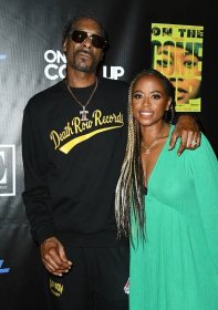  Snoop Dogg and Shante Broadus smiling. 
