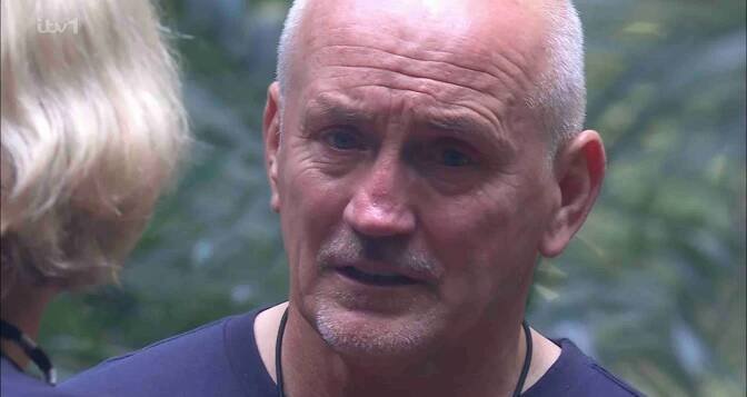 a close up of a man 's face with the letters itv on the bottom right
