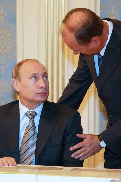Russian Prime Minister Vladimir Putin talks to a Russian Security Council Secretary Nikolai Patrushev during the Council's session in Moscow.