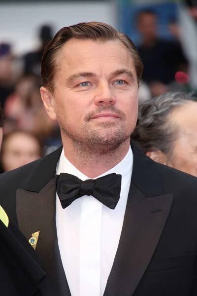 Leonardo DiCaprio with a subtle swoosh hairstyle at the 'Killers of the Flower Moon' red carpet during the Cannes Film Festival in 2023