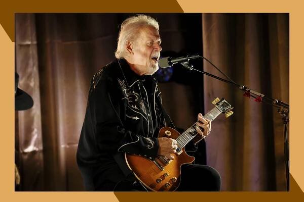 Randy Bachman sings with a guitar in an intimate concert.