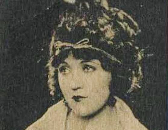 Actress Marie Prevost wearing white coat is looking at side - 1921