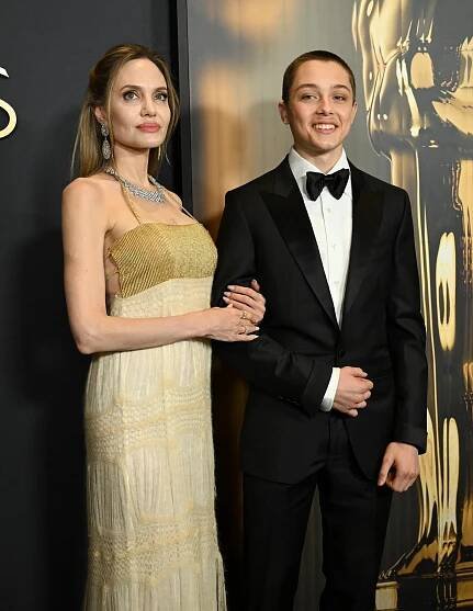 Jolie previously opened up about her desire to leave Los Angeles in 2024, but said she had to remain in California until her and Pitt's six children all turn 18; Seen with son Knox in 2024