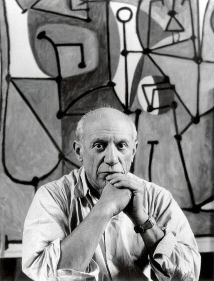 an older man with his chin resting on his hand in front of a painting and quote about drinking