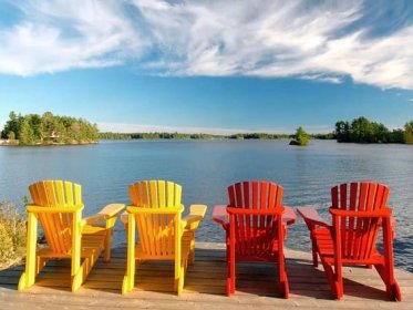 Chairs on a dock on Kahshe Lake in Muskoka Ontario