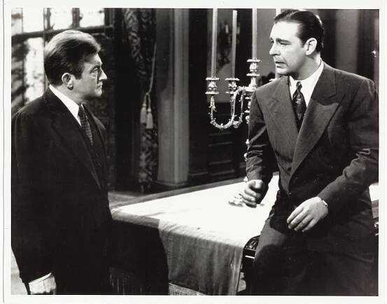 Claude Rains and Lon Chaney Jr. have a strained father and son conversation in The Wolf Man - order from Amazon.com