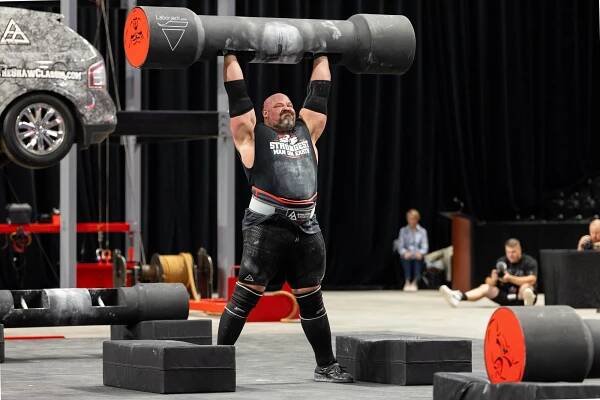 Strongest Man On Earth winner Brian Shaw lifting a massive weight at competition.