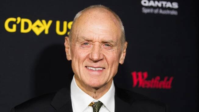 Alan Dale smiling