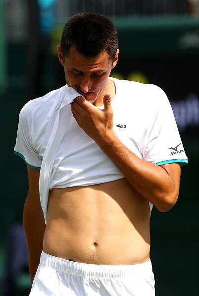 Bernard Tomic of Australia reacting during a tennis match.