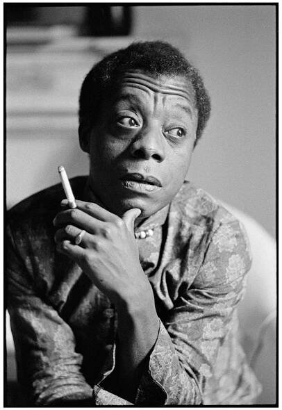 Black-and-white portrait of James Baldwin