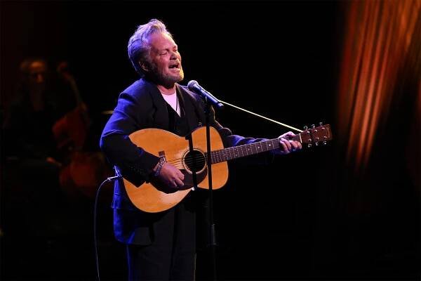 John Mellencamp sings onstage.