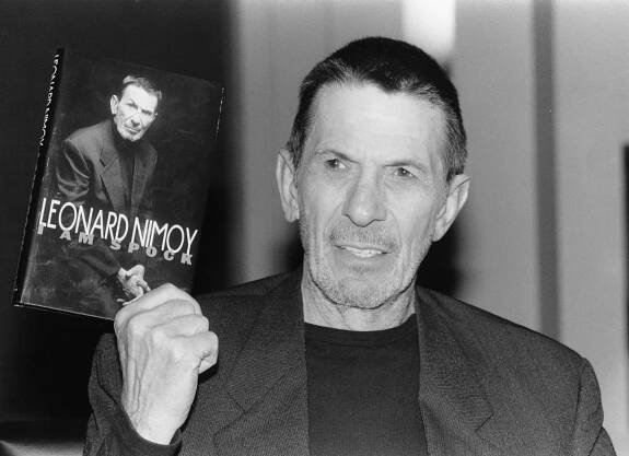 Leonard Nimoy holding his autobiography, 'I Am Spock'