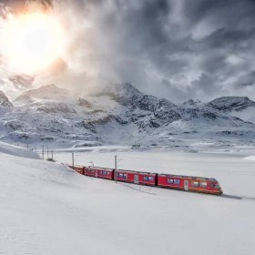 ‘The reflection of snow-tipped trees in an ice-cold lake melted hearts’: readers’ favourite winter train rides