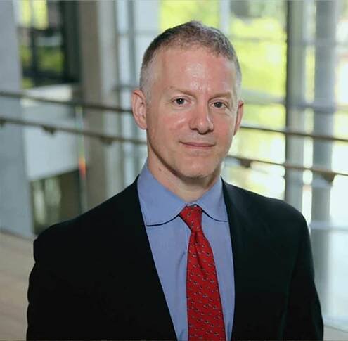 A portrait of R. Perry Frankland Associate Professor of Management David Ross.