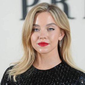 Sydney Sweeney Leaves Fans Speechless As She Wears A Leather Trench Coat & Sheer Tights In NYC—'Give Her Stylist An Award'