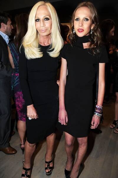 Image may contain Donatella Versace Allegra Versace Human Person Clothing Shoe Footwear Apparel and Fashion