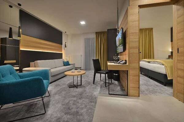 Postel nebo postele na pokoji v ubytování PREMIUM Wellness & Wine Hotel Znojmo