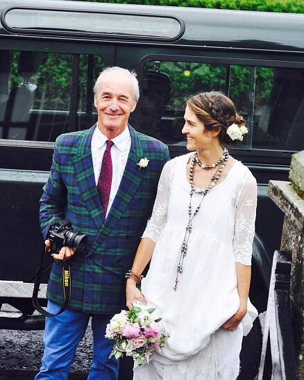 Father and bride at a wedding.