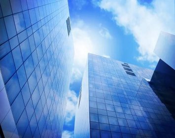 Bright Blue City Buildings with Clouds Stock Photo - Image of development, downtown: 14098922