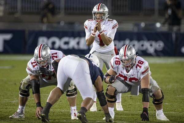 Justin Fields #1 of the Ohio State Buckeyes prepares to take the snap against the Penn State Nittany Lions during the second half at Beaver Stadium on October 31, 2020 in State College, Pennsylvania. 