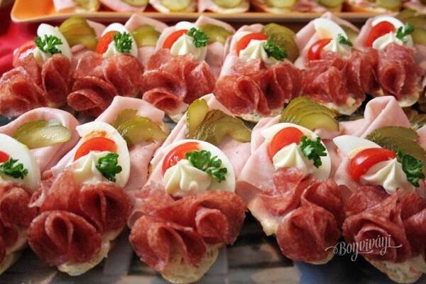 many different types of appetizers are displayed on trays