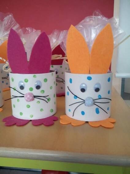 some paper cups with bunny ears on them