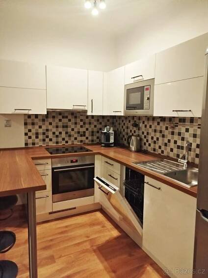 Pronájem zařízeného bytu 1+1 (2kk), balkon, sklep. Praha 9 - Praha 9