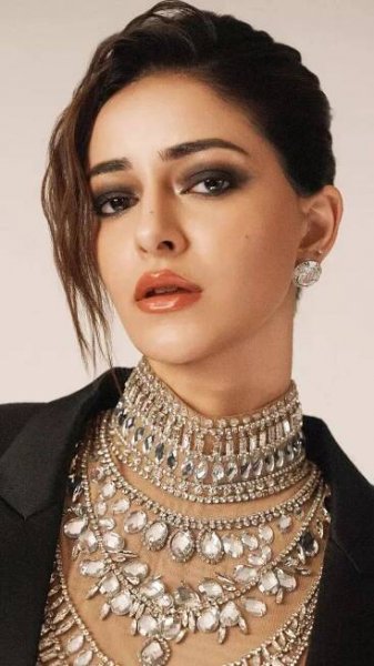 Ananya Panday stuns in a dramatic black gown with a cape blazer and a bedazzled bodysuit