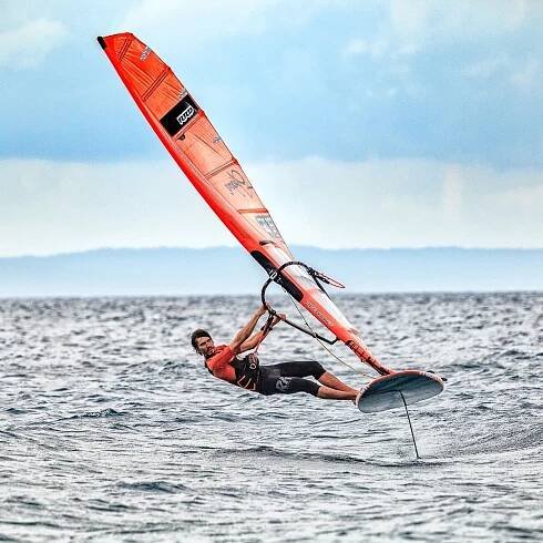 A man windsurfing in the sea near Falkensteiner Hotel Park Punat