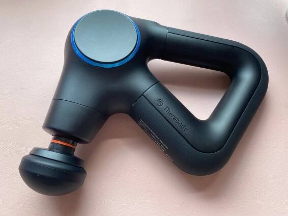 The Theragun Prime Plus' heated percussive attachment has a red stripe