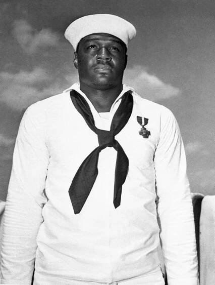 Doris Miller standing in his US Navy uniform