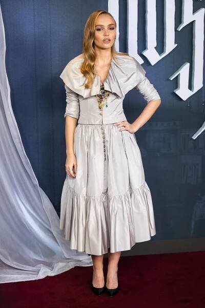 Image may contain LilyRose Depp Fashion Adult Person Clothing Dress Footwear Shoe Formal Wear and High Heel