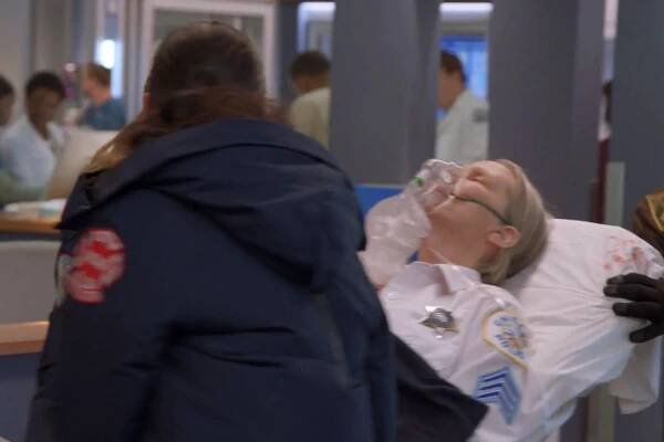 Platt (Amy Morton) being wheeled into Chicago Med