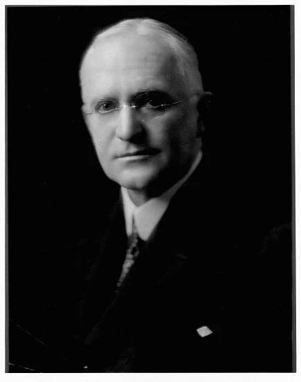 Inventor and industrialist George Eastman invented the Kodak box camera and introduced daylight-loading film.